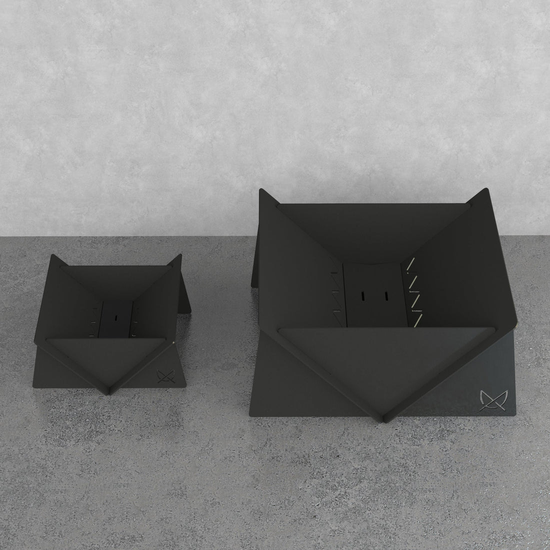 Small Fire Pit next to the larger Fire Pit XL, showing the size difference between Pretzel Designs fire pit models