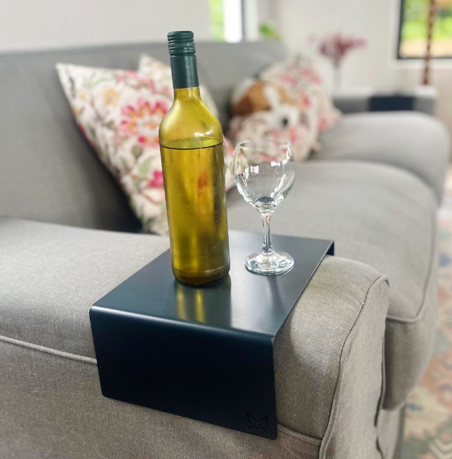 Custom steel armrest table sized to fit a sofa