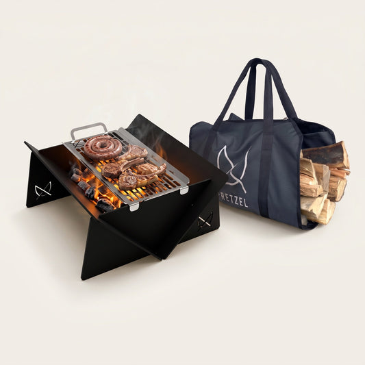 Fire Pit Mobile Pro & Grill by Pretzel Designs: portable aluminium fire pit with boerewors and chops on the grill, beside its carry bag full of logs