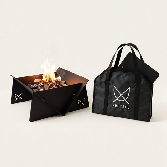 Fire Pit Mobile Pro by Pretzel Designs: portable black anodised aluminium fire pit with a fire, next to its Pretzel carry bag