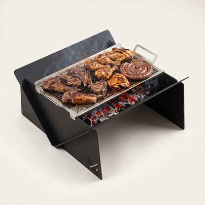 Fire Pit XL & Grill by Pretzel Designs: 80cm black steel fire pit with a large stainless steel grill loaded with chops, chicken and boerewors